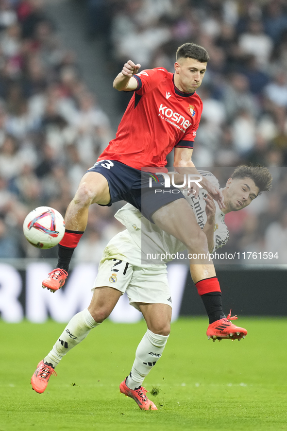 Brahim Diaz attacking midfield of Real Madrid and Spain and Abel Bretones left-back of Osasuna and Spain compete for the ball during the La...