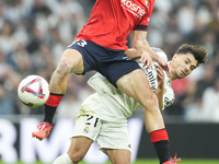 Brahim Diaz attacking midfield of Real Madrid and Spain and Abel Bretones left-back of Osasuna and Spain compete for the ball during the La...