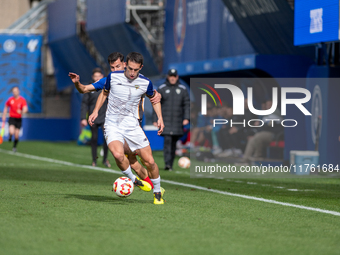 Luismi Redondo of FC Andorra and Iker Pedernales of Barakaldo CF are in action during the Primera RFEF 2024-2025 match between FC Andorra an...