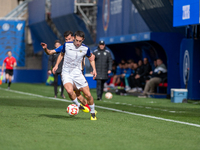 Luismi Redondo of FC Andorra and Iker Pedernales of Barakaldo CF are in action during the Primera RFEF 2024-2025 match between FC Andorra an...