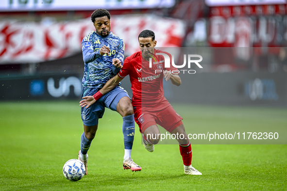 AFC Ajax Amsterdam forward Chuba Akpom and FC Twente defender Anass Salah-Eddine play during the match between Twente and Ajax at the Grolsc...