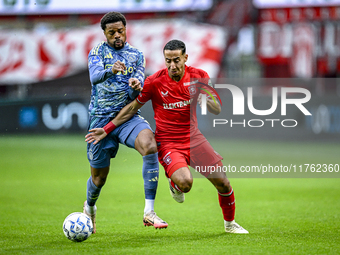 AFC Ajax Amsterdam forward Chuba Akpom and FC Twente defender Anass Salah-Eddine play during the match between Twente and Ajax at the Grolsc...