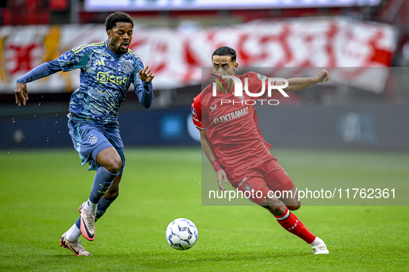 AFC Ajax Amsterdam forward Chuba Akpom and FC Twente defender Anass Salah-Eddine play during the match between Twente and Ajax at the Grolsc...