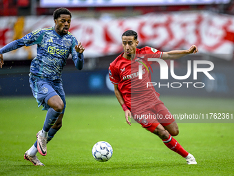 AFC Ajax Amsterdam forward Chuba Akpom and FC Twente defender Anass Salah-Eddine play during the match between Twente and Ajax at the Grolsc...