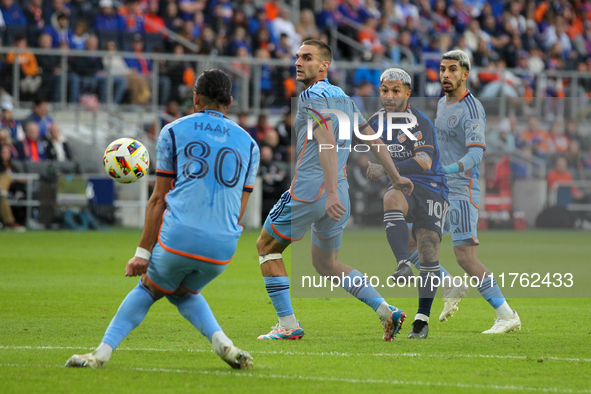 Luciano Acosta takes a shot on goal during the 2024 MLS Cup Playoffs Round One match between FC Cincinnati and New York City FC at TQL Stadi...