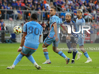 Luciano Acosta takes a shot on goal during the 2024 MLS Cup Playoffs Round One match between FC Cincinnati and New York City FC at TQL Stadi...