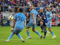 Luciano Acosta takes a shot on goal during the 2024 MLS Cup Playoffs Round One match between FC Cincinnati and New York City FC at TQL Stadi...