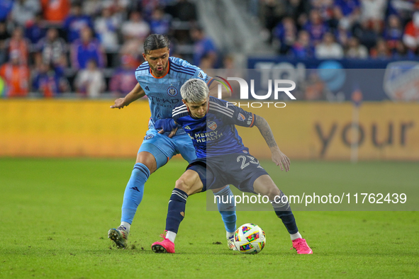 Cincinnati's Luca Orellano and New York's Justin Haak compete for the ball during the 2024 MLS Cup Playoffs Round One match between FC Cinci...