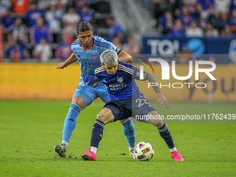 Cincinnati's Luca Orellano and New York's Justin Haak compete for the ball during the 2024 MLS Cup Playoffs Round One match between FC Cinci...