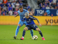 Cincinnati's Luca Orellano and New York's Justin Haak compete for the ball during the 2024 MLS Cup Playoffs Round One match between FC Cinci...