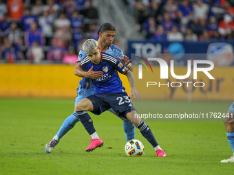 Cincinnati's Luca Orellano and New York's Justin Haak compete for the ball during the 2024 MLS Cup Playoffs Round One match between FC Cinci...