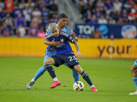 Cincinnati's Luca Orellano and New York's Justin Haak compete for the ball during the 2024 MLS Cup Playoffs Round One match between FC Cinci...