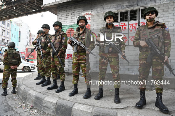 Bangladesh army soldiers stand guard at an intersection in the Mirpur area during an anti-discrimination student movement determined to foil...