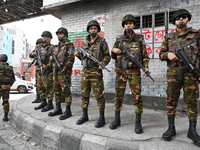 Bangladesh army soldiers stand guard at an intersection in the Mirpur area during an anti-discrimination student movement determined to foil...