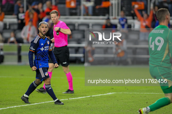 Luciano Acosta of Cincinnati reacts to New York City goalie Matt Freese after scoring on a penalty kick during the 2024 MLS Cup Playoffs Rou...