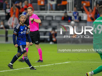 Luciano Acosta of Cincinnati reacts to New York City goalie Matt Freese after scoring on a penalty kick during the 2024 MLS Cup Playoffs Rou...