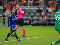 Luciano Acosta of Cincinnati reacts to New York City goalie Matt Freese after scoring on a penalty kick during the 2024 MLS Cup Playoffs Rou...