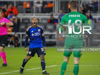 Luciano Acosta of Cincinnati reacts to New York City goalie Matt Freese after scoring on a penalty kick during the 2024 MLS Cup Playoffs Rou...