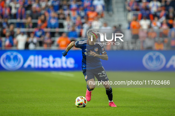 Luca Oreallano of Cincinnati moves the ball upfield during the 2024 MLS Cup Playoffs Round One match between FC Cincinnati and New York City...