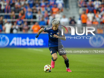 Luca Oreallano of Cincinnati moves the ball upfield during the 2024 MLS Cup Playoffs Round One match between FC Cincinnati and New York City...