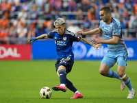 Luca Oreallano of Cincinnati moves the ball upfield during the 2024 MLS Cup Playoffs Round One match between FC Cincinnati and New York City...