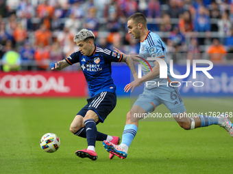 Luca Oreallano of Cincinnati moves the ball upfield during the 2024 MLS Cup Playoffs Round One match between FC Cincinnati and New York City...