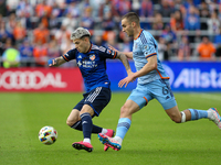 Luca Oreallano of Cincinnati moves the ball upfield during the 2024 MLS Cup Playoffs Round One match between FC Cincinnati and New York City...