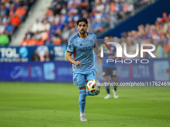 Thiago Martins moves the ball upfield during the 2024 MLS Cup Playoffs Round One match between FC Cincinnati and New York City FC at TQL Sta...