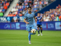 Thiago Martins moves the ball upfield during the 2024 MLS Cup Playoffs Round One match between FC Cincinnati and New York City FC at TQL Sta...