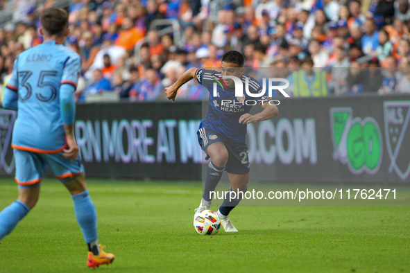 Yamil Asad of Cincinnati moves the ball upfield during the 2024 MLS Cup Playoffs Round One match between FC Cincinnati and New York City FC...