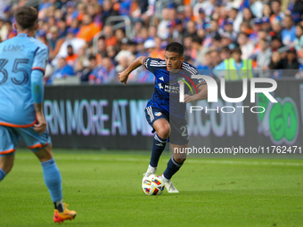 Yamil Asad of Cincinnati moves the ball upfield during the 2024 MLS Cup Playoffs Round One match between FC Cincinnati and New York City FC...