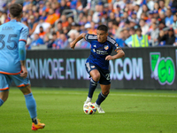 Yamil Asad of Cincinnati moves the ball upfield during the 2024 MLS Cup Playoffs Round One match between FC Cincinnati and New York City FC...