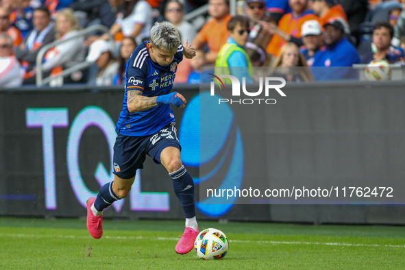 Luca Orellano of Cincinnati moves the ball upfield during the 2024 MLS Cup Playoffs Round One match between FC Cincinnati and New York City...