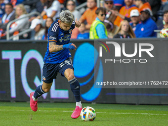 Luca Orellano of Cincinnati moves the ball upfield during the 2024 MLS Cup Playoffs Round One match between FC Cincinnati and New York City...