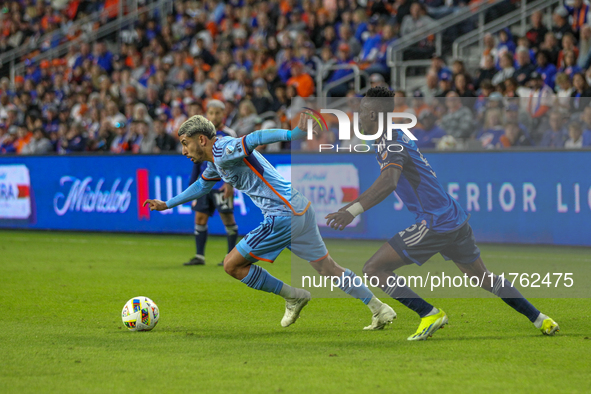 Santiago Rodriguez of New York moves the ball upfield during the 2024 MLS Cup Playoffs Round One match between FC Cincinnati and New York Ci...