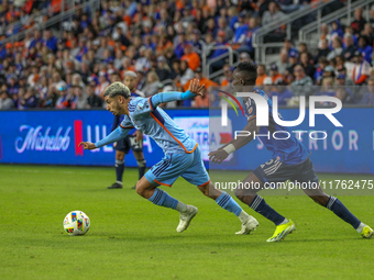 Santiago Rodriguez of New York moves the ball upfield during the 2024 MLS Cup Playoffs Round One match between FC Cincinnati and New York Ci...