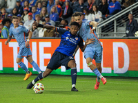 Cincinnati's Alvas Powell and New York's Kevin O'Toole compete for the ball during the 2024 MLS Cup Playoffs Round One match between FC Cinc...