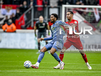 AFC Ajax Amsterdam forward Chuba Akpom and FC Twente defender Anass Salah-Eddine play during the match between Twente and Ajax at the Grolsc...