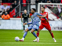 AFC Ajax Amsterdam forward Chuba Akpom and FC Twente defender Anass Salah-Eddine play during the match between Twente and Ajax at the Grolsc...