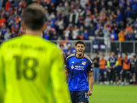 Miles Robinson gestures to goalie Roman Celentano after scoring a penalty kick during the 2024 MLS Cup Playoffs Round One match between FC C...