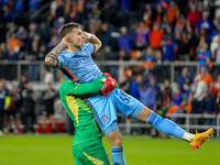 New York goalie Matt Freese lifts teammate Mitja Ilenic after scoring the decisive penalty kick during the 2024 MLS Cup Playoffs Round One m...