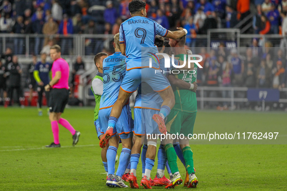 New York City players celebrate after winning on penalty kicks in the 2024 MLS Cup Playoffs Round One match between FC Cincinnati and New Yo...