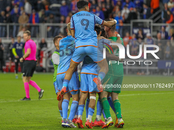 New York City players celebrate after winning on penalty kicks in the 2024 MLS Cup Playoffs Round One match between FC Cincinnati and New Yo...