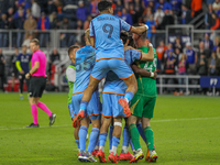 New York City players celebrate after winning on penalty kicks in the 2024 MLS Cup Playoffs Round One match between FC Cincinnati and New Yo...