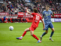 FC Twente forward Sam Lammers and AFC Ajax Amsterdam defender Youri Baas play during the match between Twente and Ajax at the Grolsch Veste...