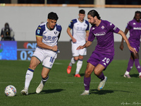 Yacine Adli of ACF Fiorentina and Abdou Harroui of Hellas Verona FC ,battle for the ball during the Italian Serie A football match between A...