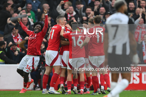 The Reds celebrate after Murillo of Nottingham Forest scores a goal during the Premier League match between Nottingham Forest and Newcastle...