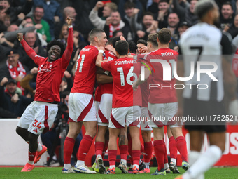 The Reds celebrate after Murillo of Nottingham Forest scores a goal during the Premier League match between Nottingham Forest and Newcastle...