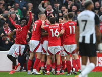 The Reds celebrate after Murillo of Nottingham Forest scores a goal during the Premier League match between Nottingham Forest and Newcastle...