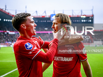 FC Twente forward Daan Rots and FC Twente midfielder Michel Vlap celebrate the 1-0 goal during the match between Twente and Ajax at the Grol...